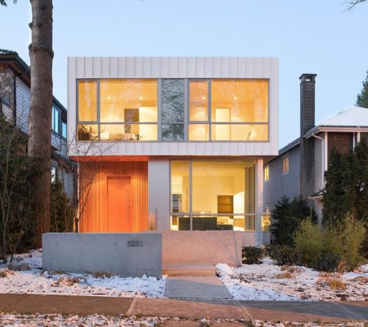 This modern home in Vancouver, Canada, has an exterior of wood (Douglas Fire), aluminum and large glass windows.